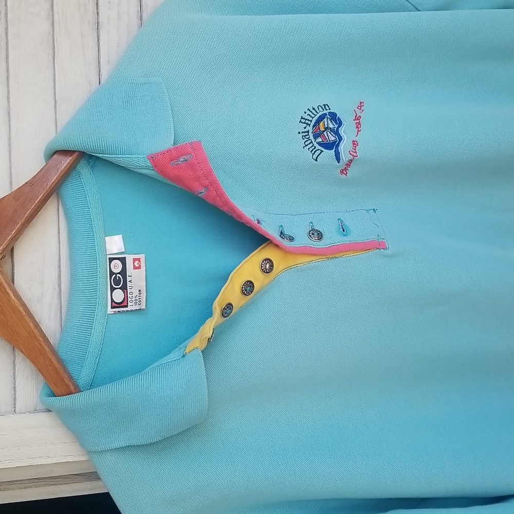Dubai Hilton men's  s/s powder blue golf shirt.